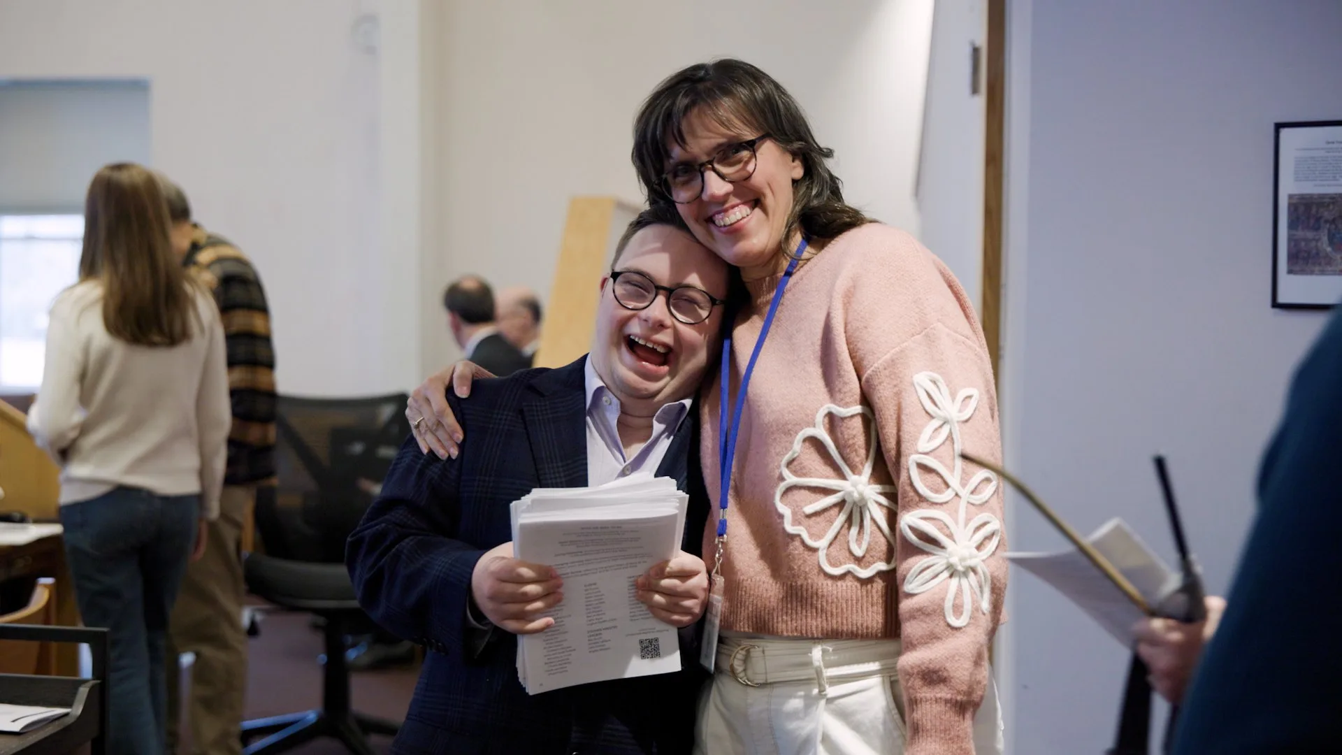 A woman embraces a young man with Down syndrome at the Worship As One summit