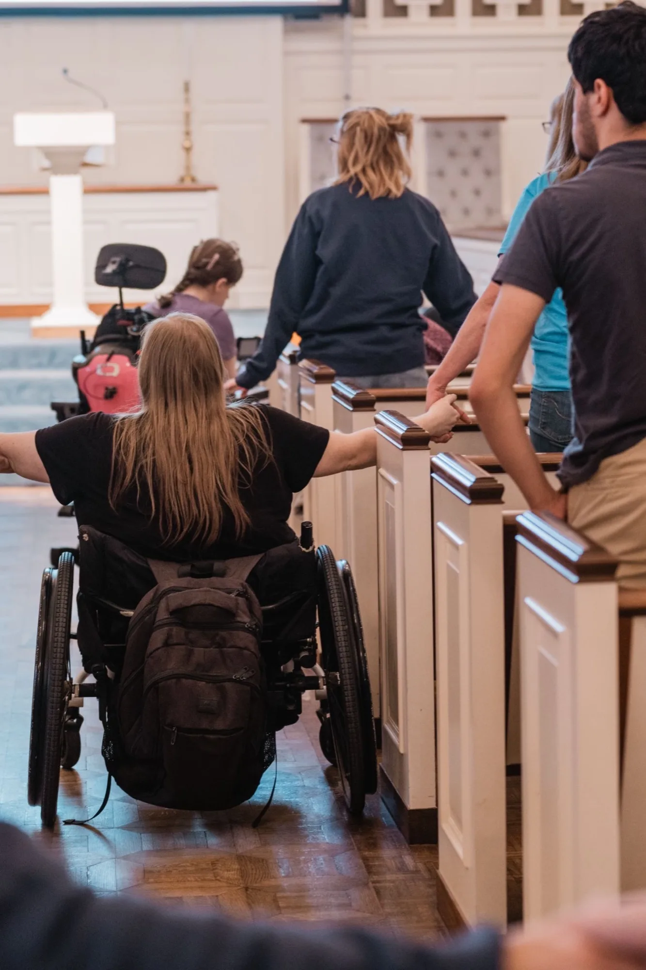Flourish Fall 2026 summit worship Summit attendees in a sanctuary, one using a wheelchair